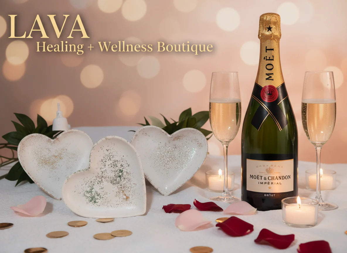 Bottle champagne with two glasses on a table with heart-shaped decorations and candles